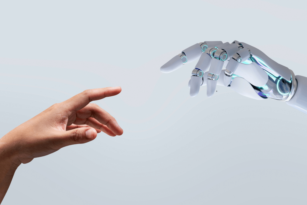 En mänsklig hand och en robotarm möts med pekfingrarna, symboliserande samverkan mellan människa och AI inom försäljning och marknadsföring.